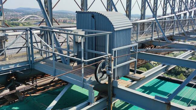 The toilet half way across the truss